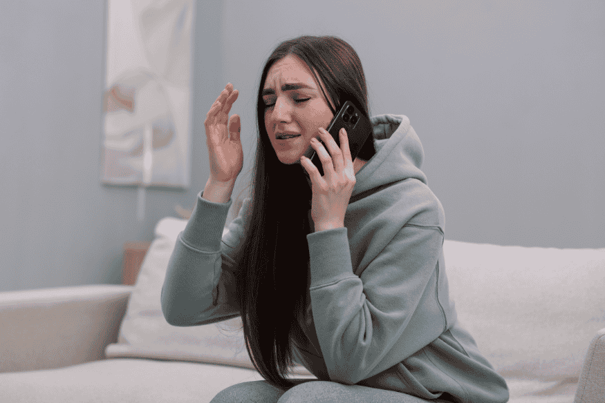 Worried credit card holder calling the bank after noticing potential fraud