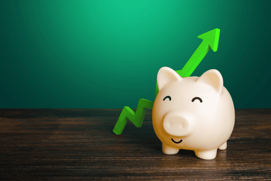 Happy piggy bank with green upward arrow illustrating growing financial surplus and savings