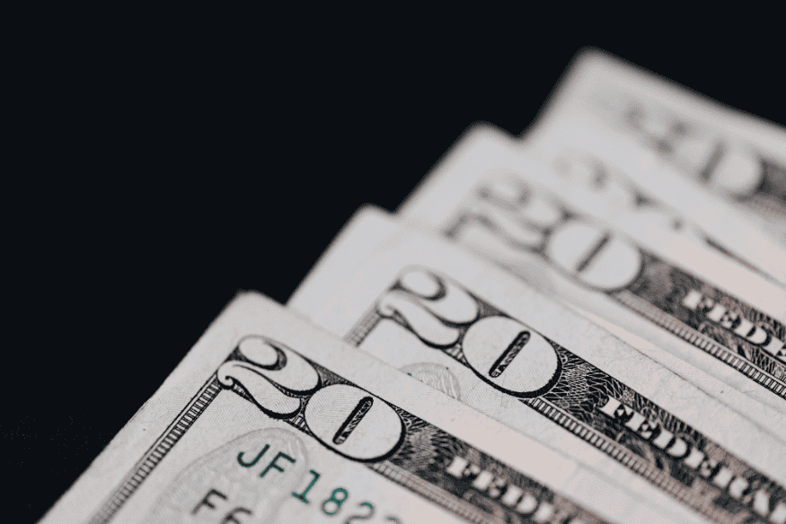 Stack of twenty dollar bills symbolizing cash set aside in sinking funds for upcoming costs