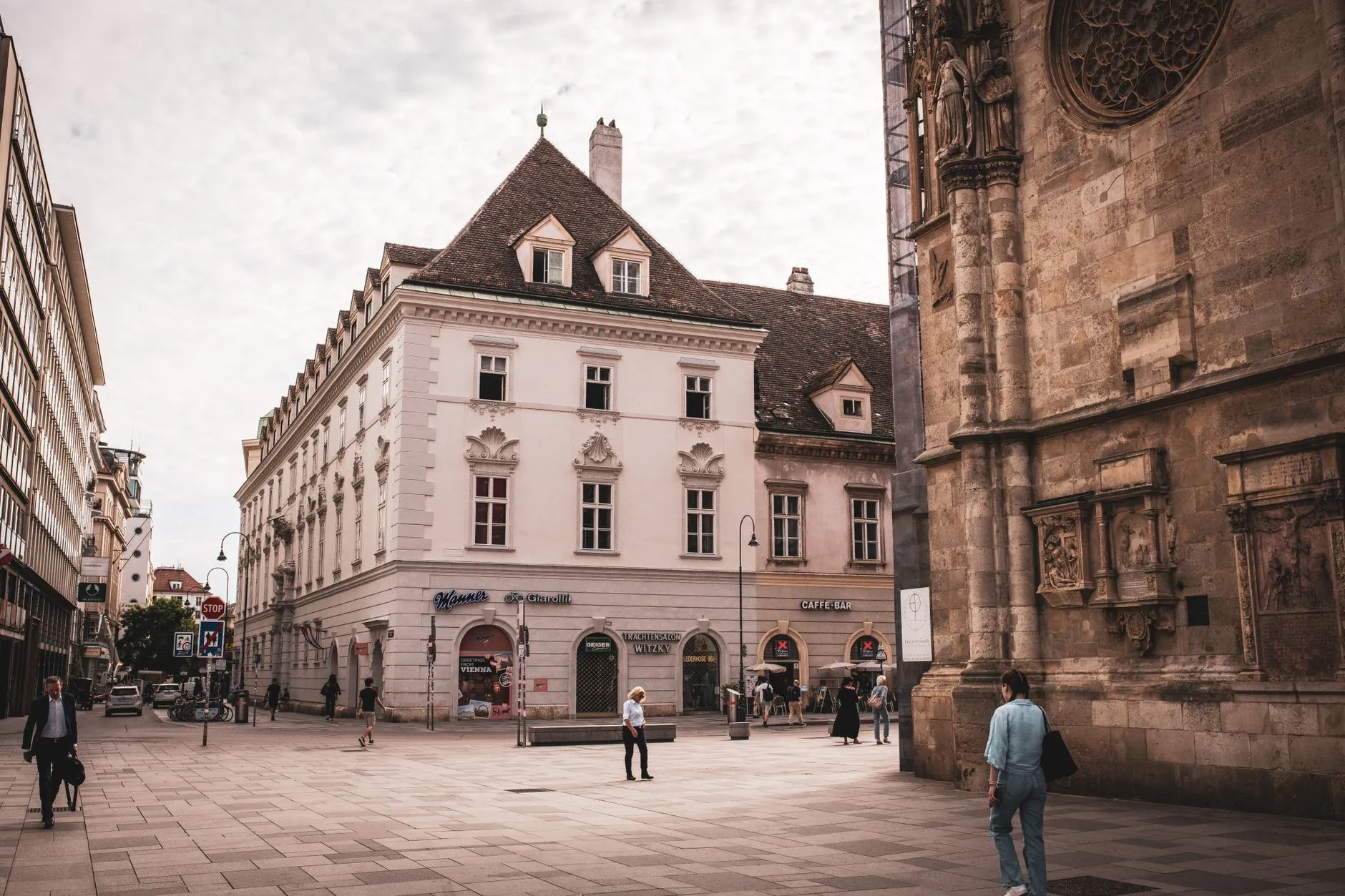 A quaint European street surrounded by historic architecture, capturing city life.