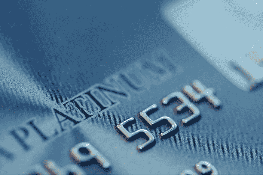 Close-up of a platinum credit card representing top-tier premium card status.