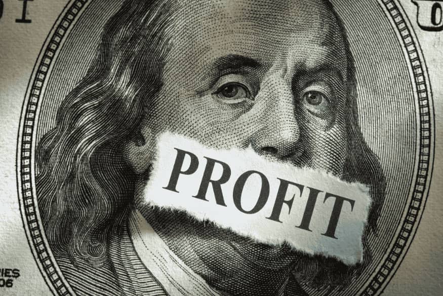 Close-up of dollar bill with the word profit across the mouth highlighting the importance of prioritizing profit first