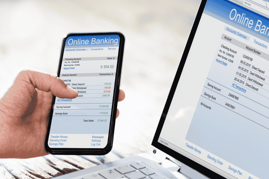Customer managing a secured credit card through online banking on smartphone and laptop.